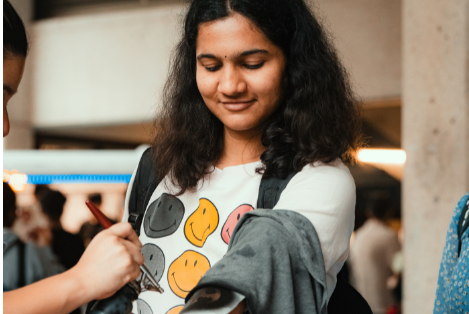 Student Getting a Spray Tattoo